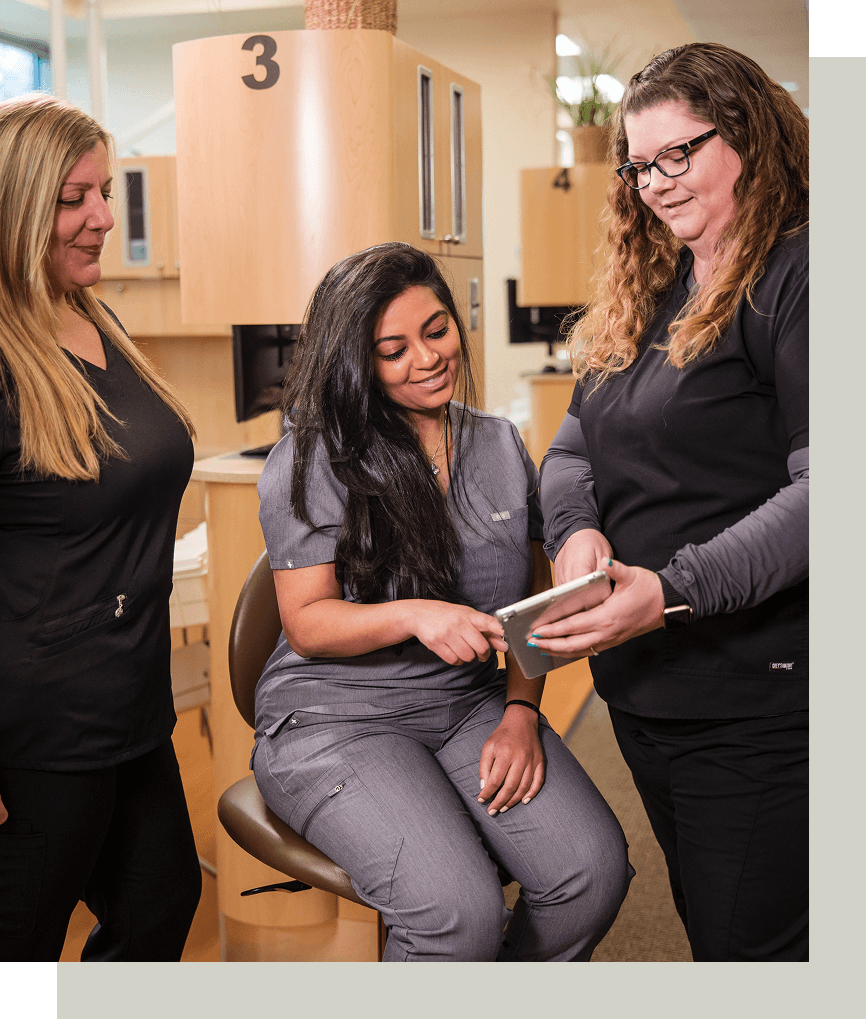 Dr. Trusha Patel's team working, general dentist at Dental Professionals in Tigard, OR